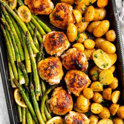sheet pan with roasted chicken thighs, asparagus and potatoes