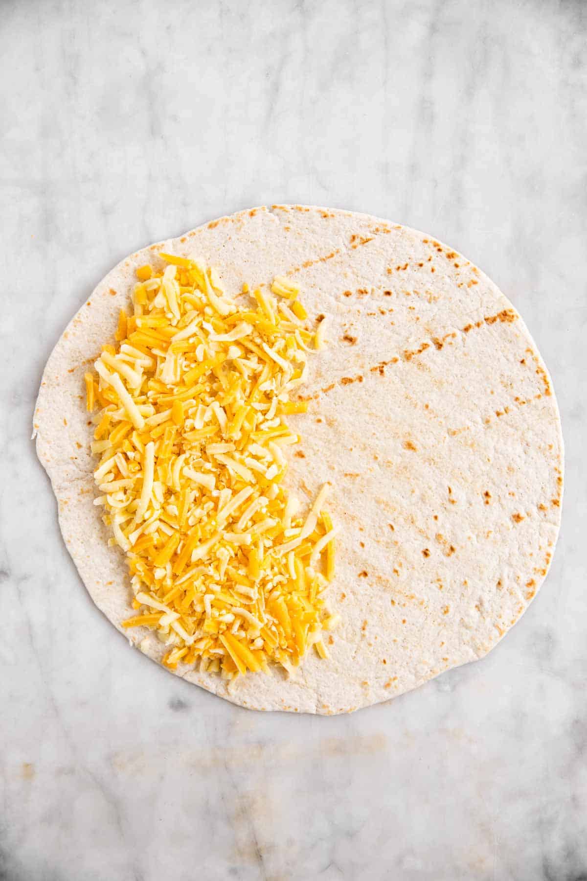 tortilla wrap with cheese on one half