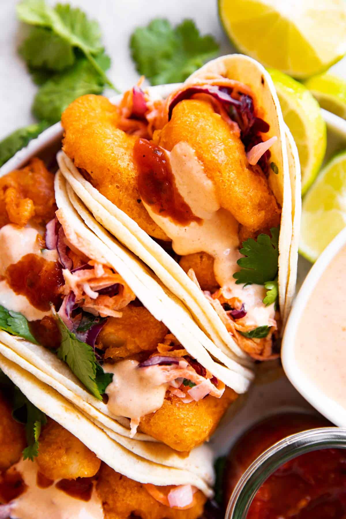 close up photo of fish tacos with chipotle mayo