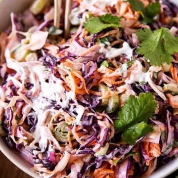 frontal view of a white bowl filled with cilantro lime slaw