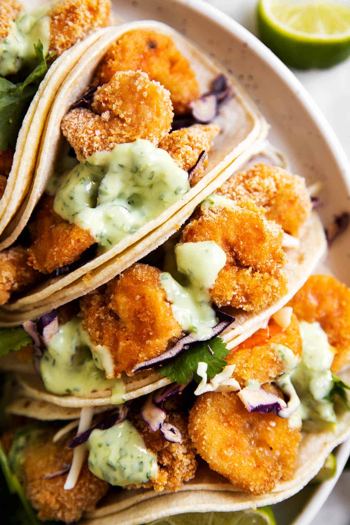 overhead view of shrimp tacos together on white plate