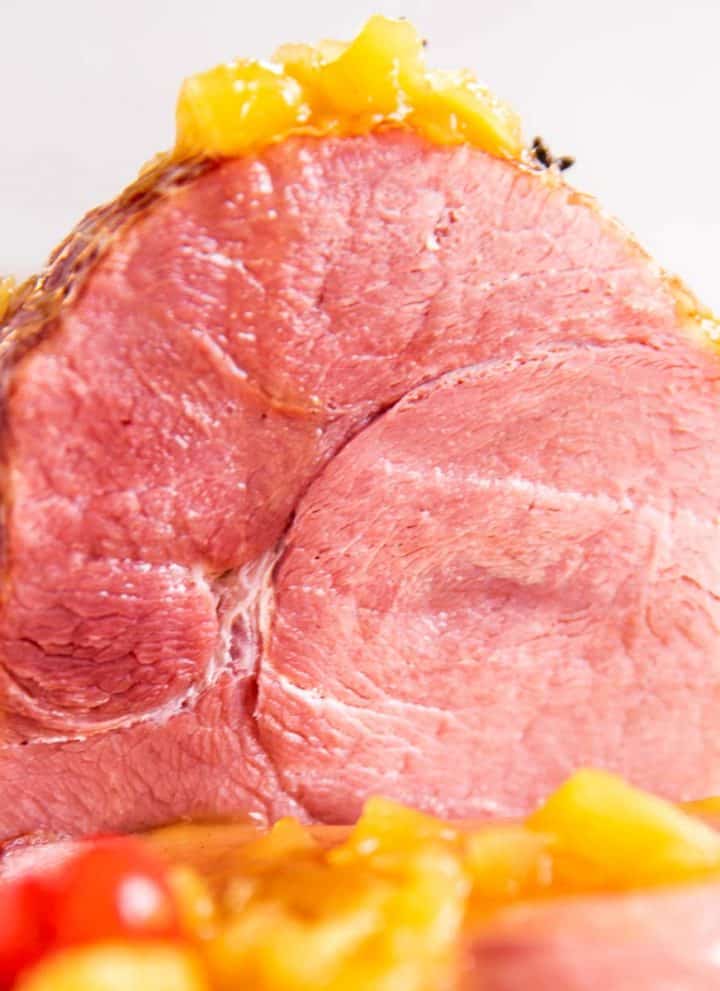 frontal view of sliced open brown sugar pineapple ham