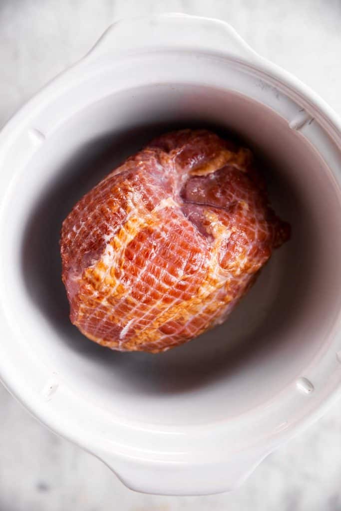 fully cooked ham in white crockpot