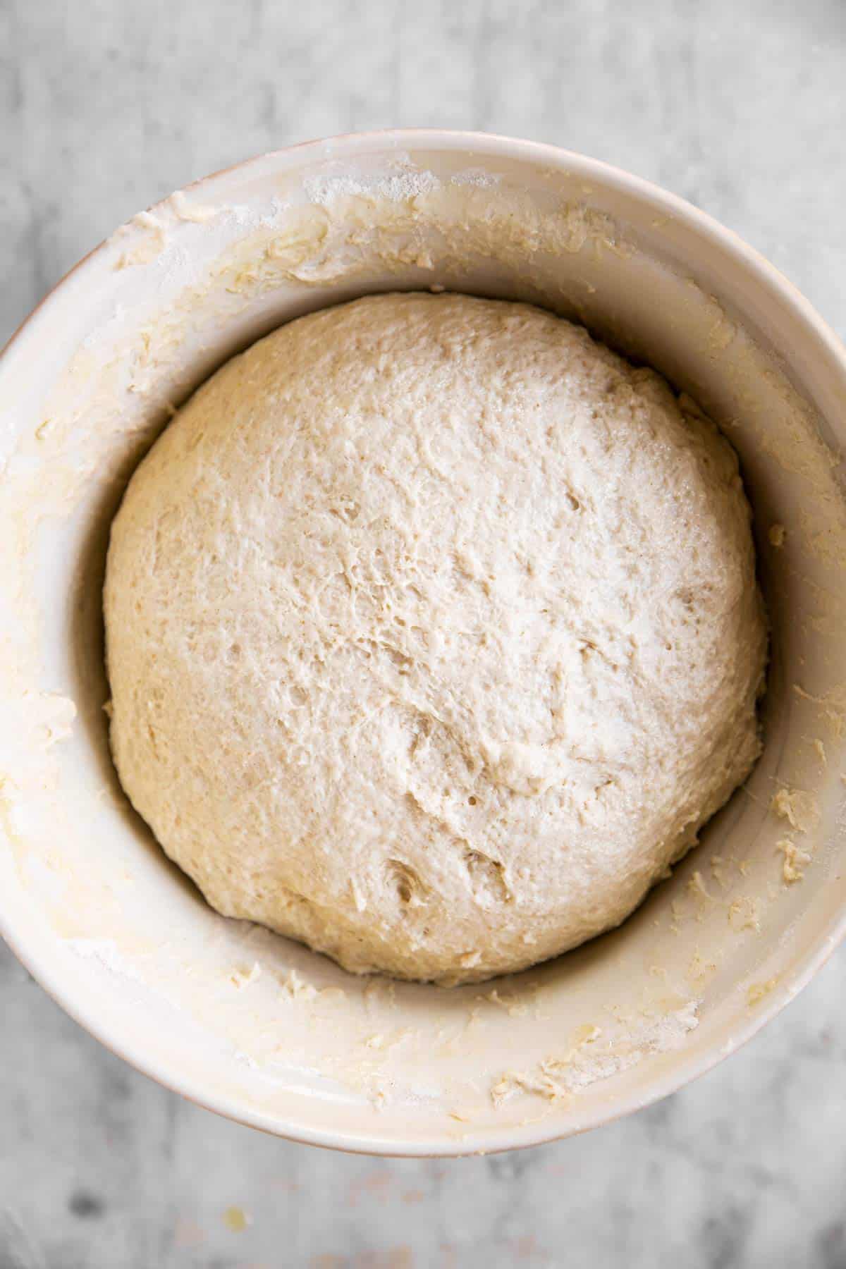 sourdough bread dough in white bowl before first rise
