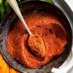 homemade fajita seasoning in black metal dish with spoon