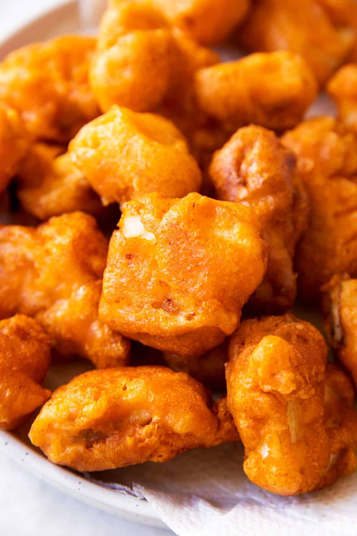 close up photo of beer battered and fried fish chunks