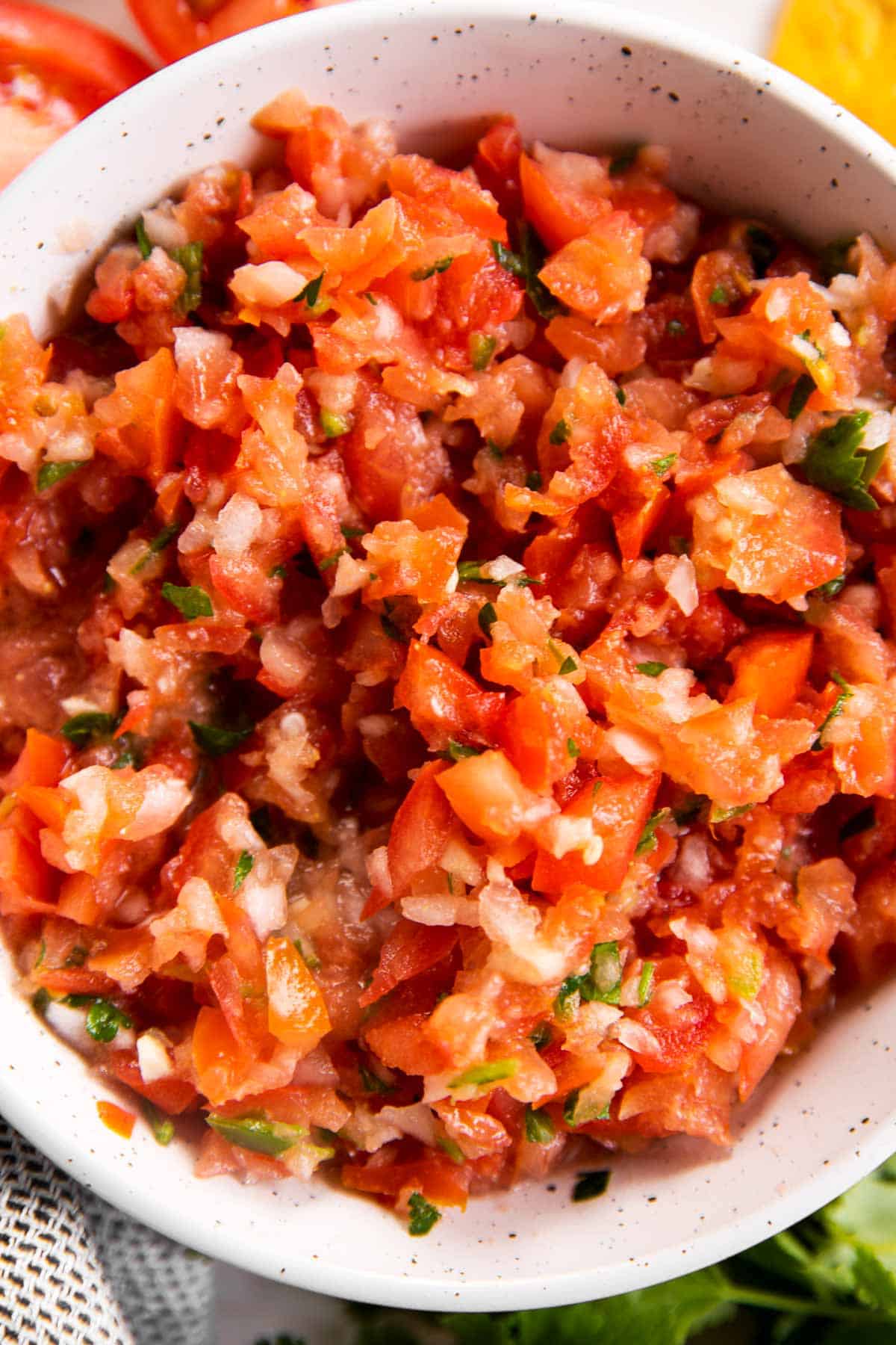 overhead view of fresh salsa in white bowl