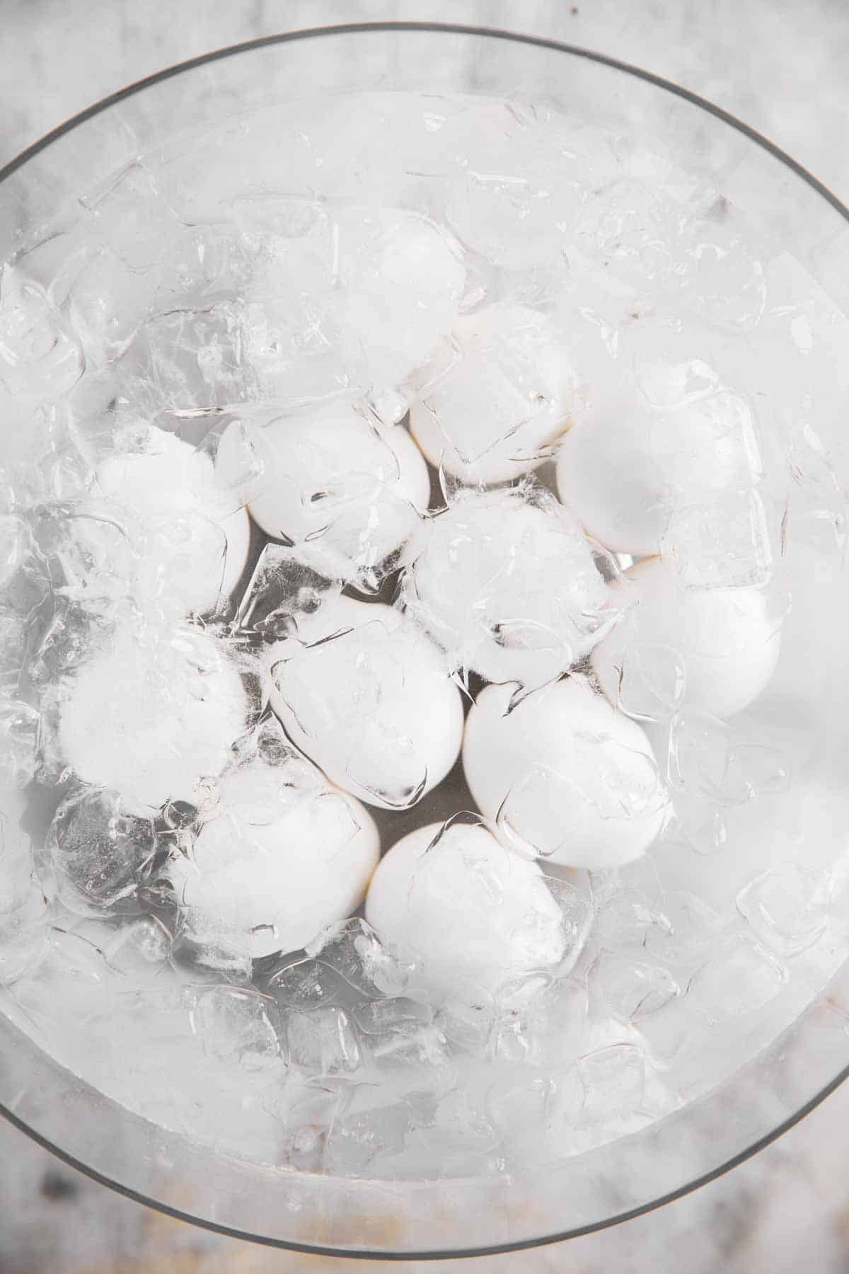 boiled eggs in glass bowl with ice water