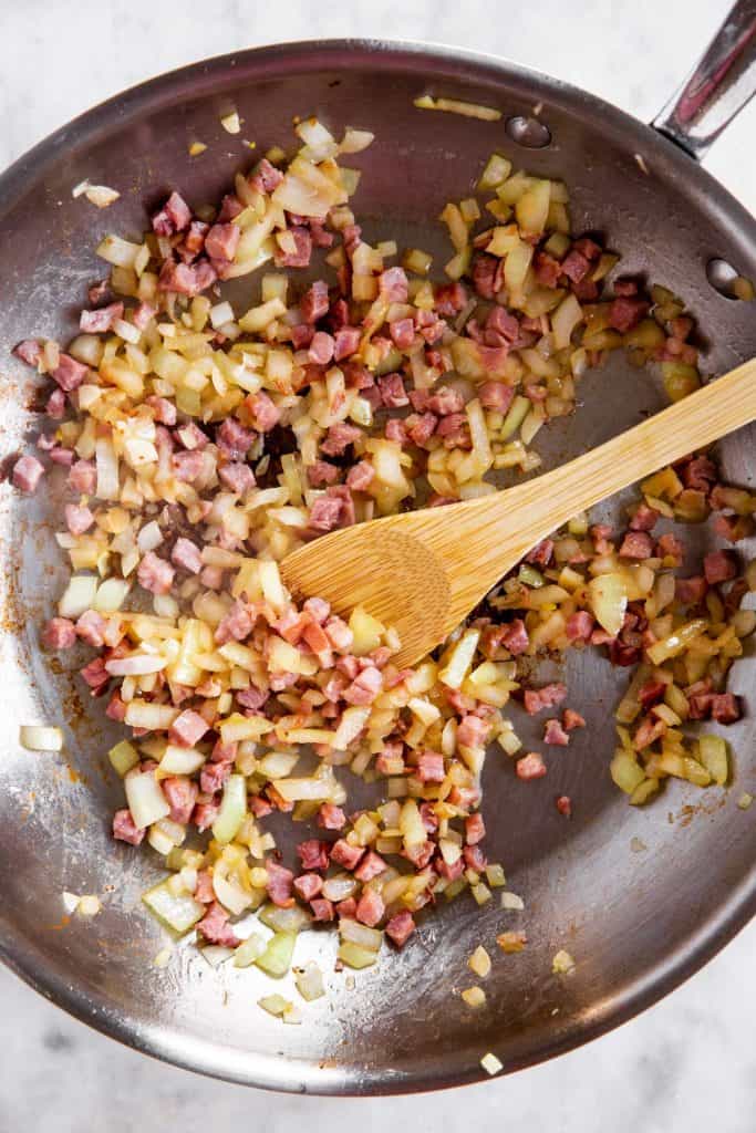 sautéed bacon, onion and garlic in stainless steel skillet