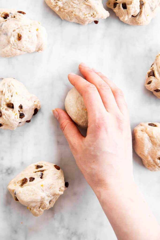 female hand rolling bun