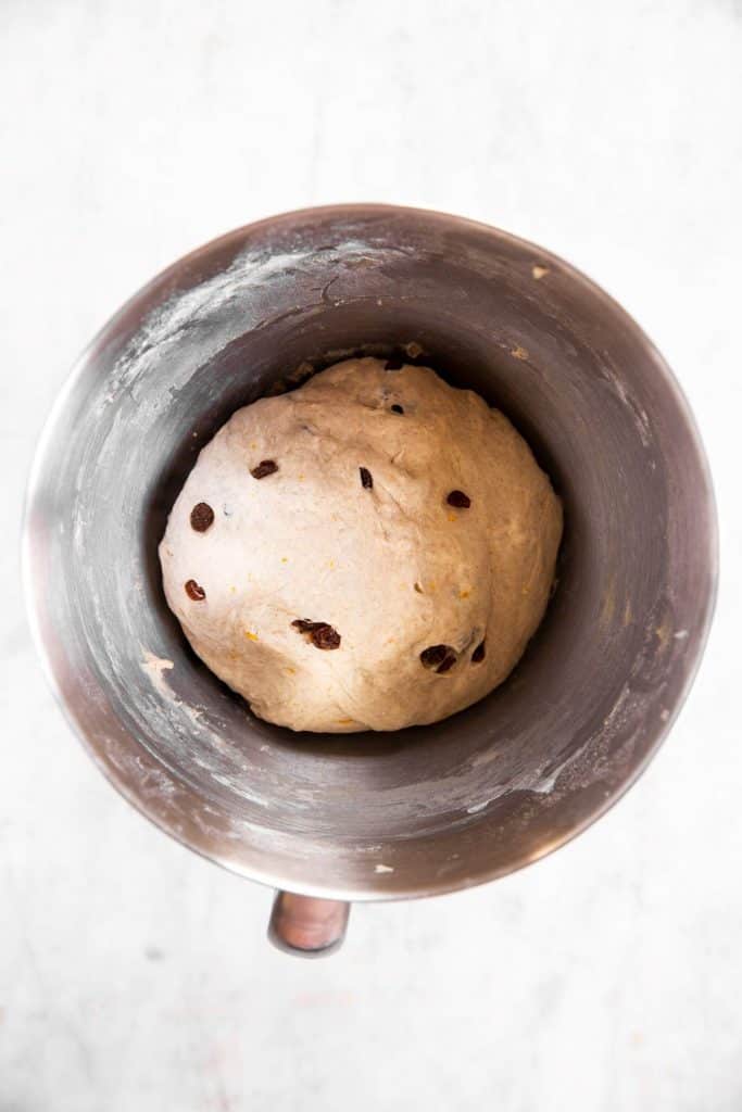 hot cross bun dough in bowl before second rise