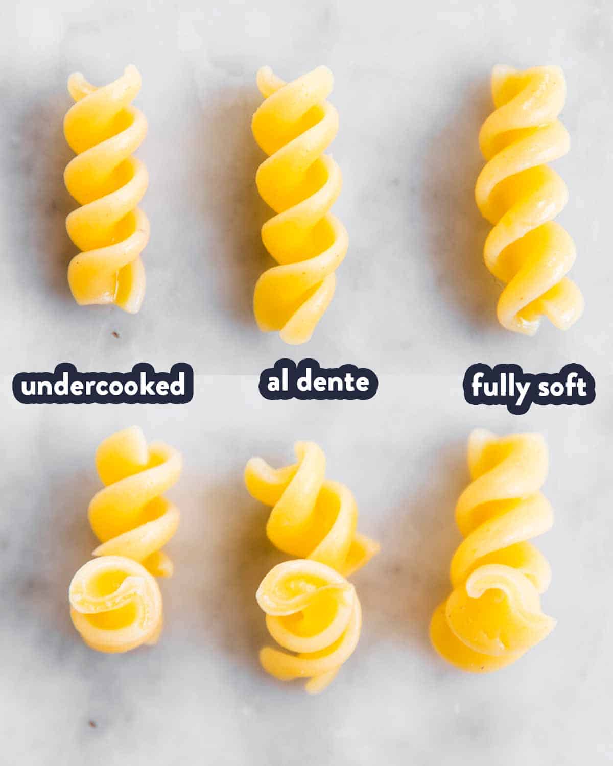 comparison of three differently cooked pasta spirals (undercooked, al dente and soft)