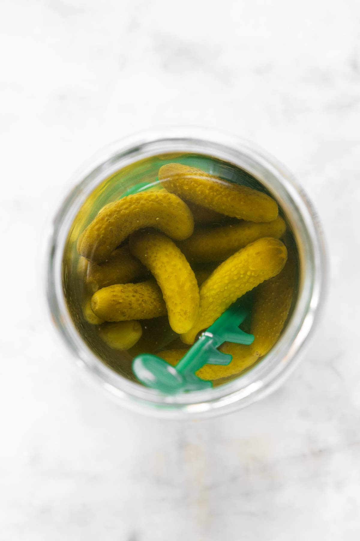 overhead view of opened glass of Cornichon pickles