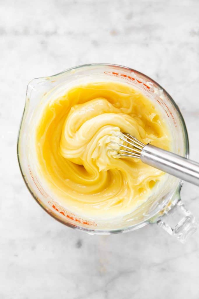 homemade mayonnaise in glass measuring jug before adding seasoning