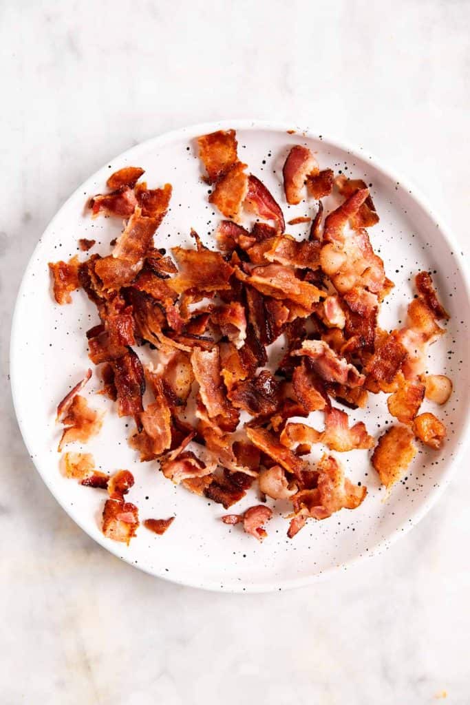 crumbled bacon on white plate