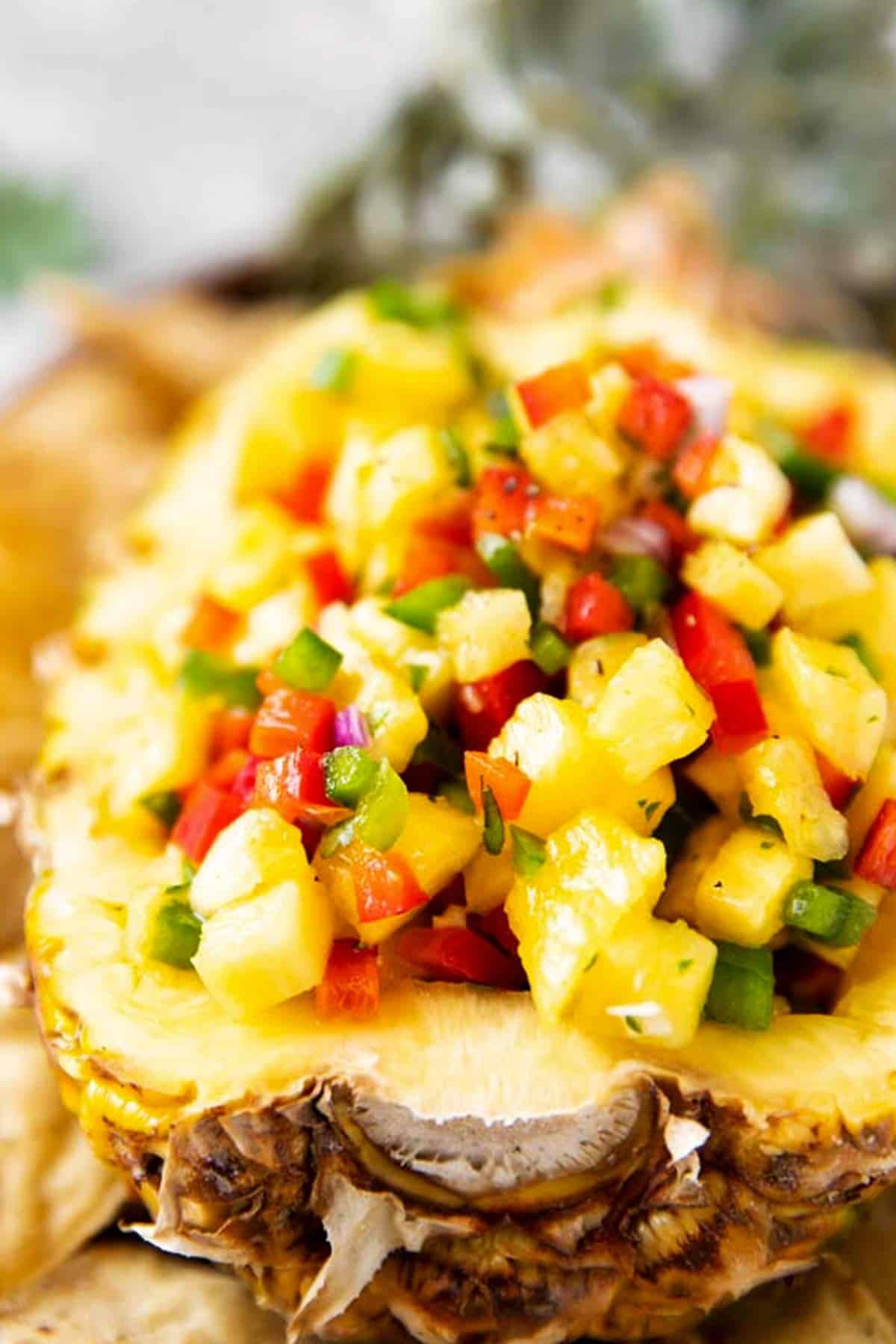 close up photo of pineapple salsa inside hollowed out pineapple