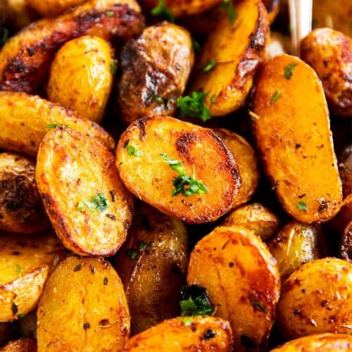 close up view of roasted baby potatoes in serving bowl