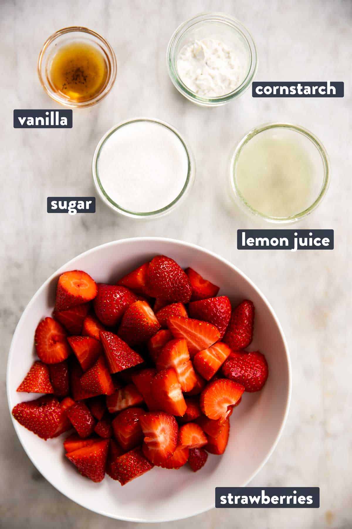 ingredients for strawberry sauce with text labels