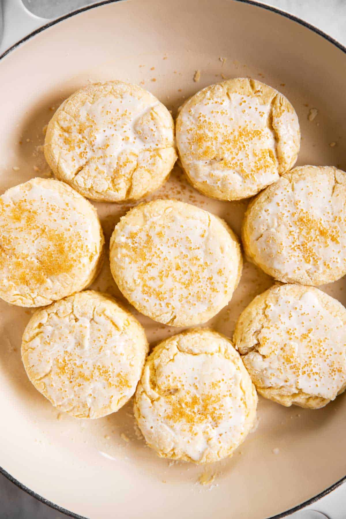 biscuits in skillet with coarse sugar on top