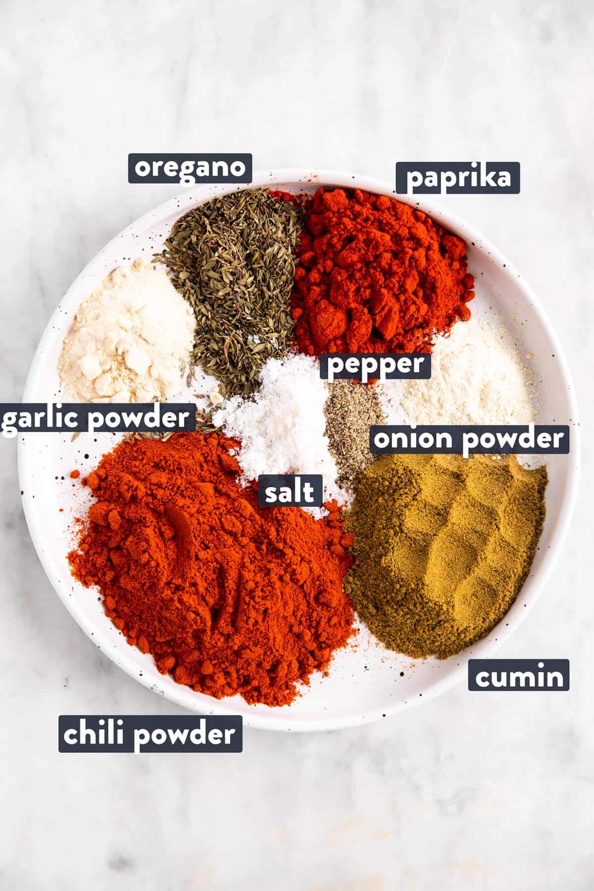 ingredients for homemade taco seasoning with text labels