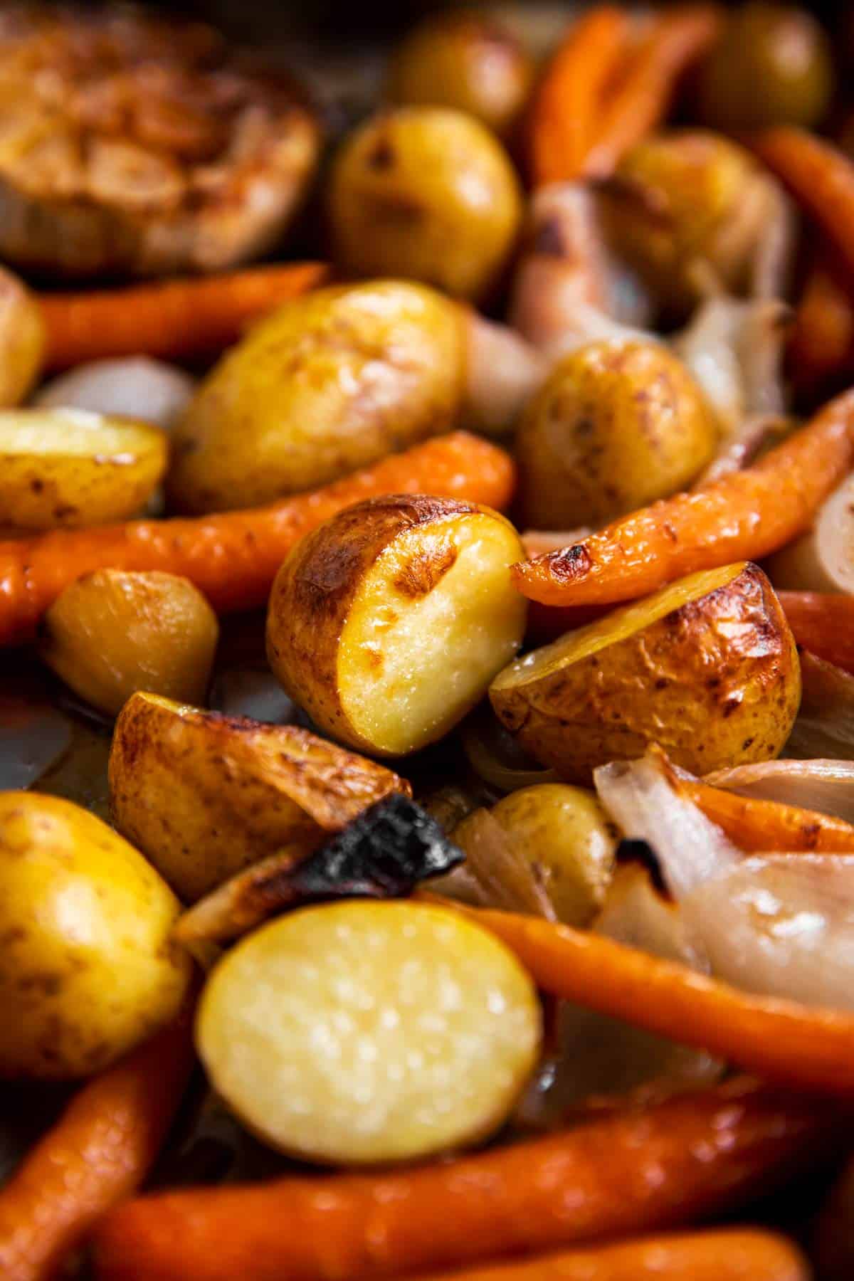 close up photo of roasted carrots and potatoes