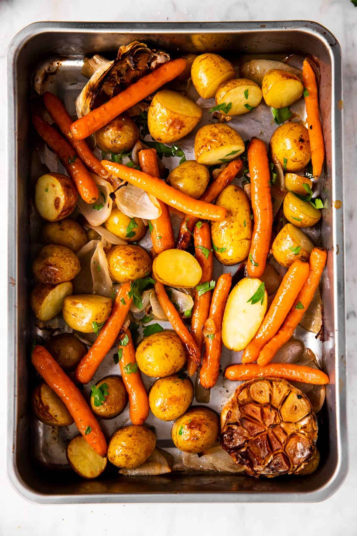 roasted carrots and potatoes in roasting pan