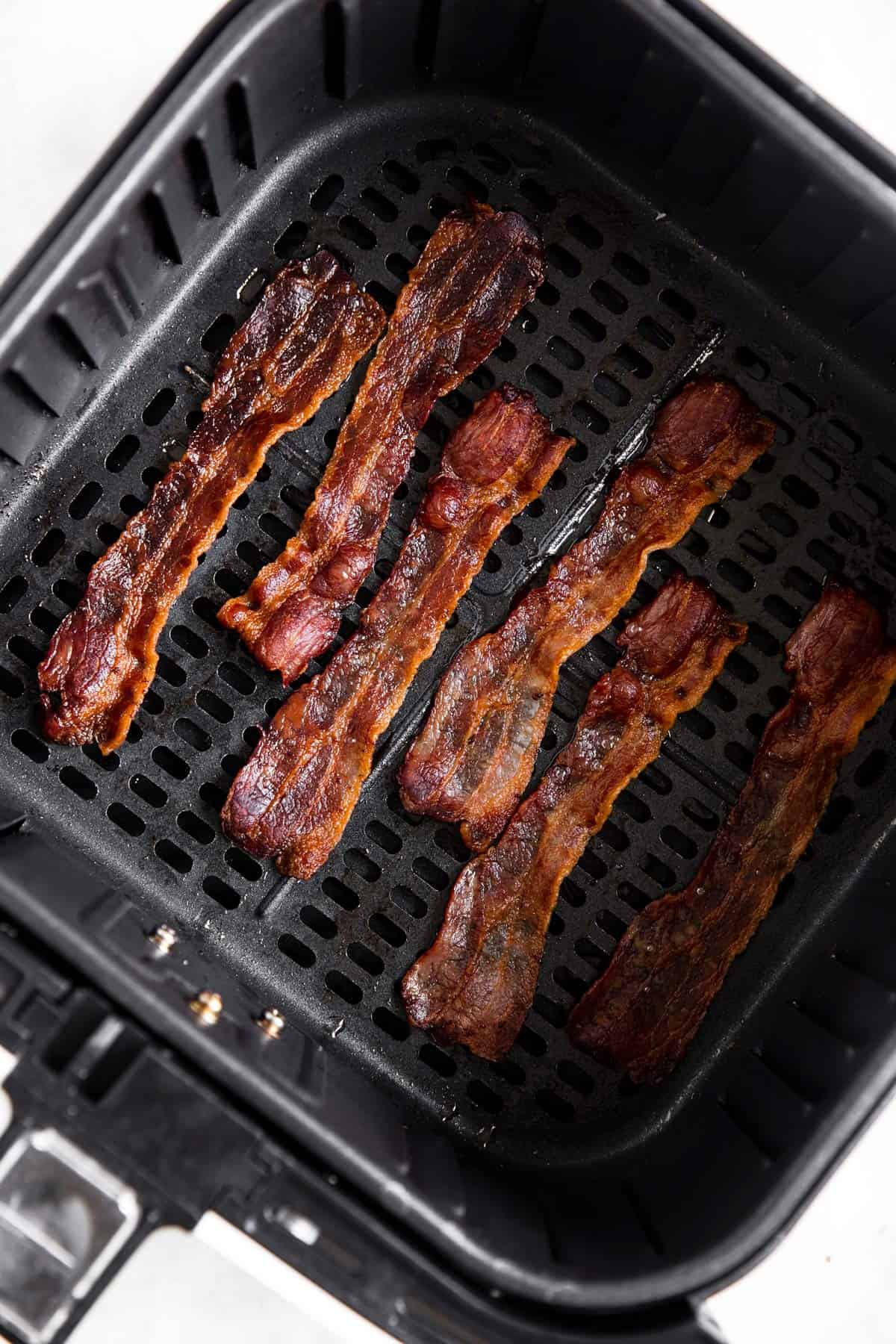 cooked bacon in air fryer basket