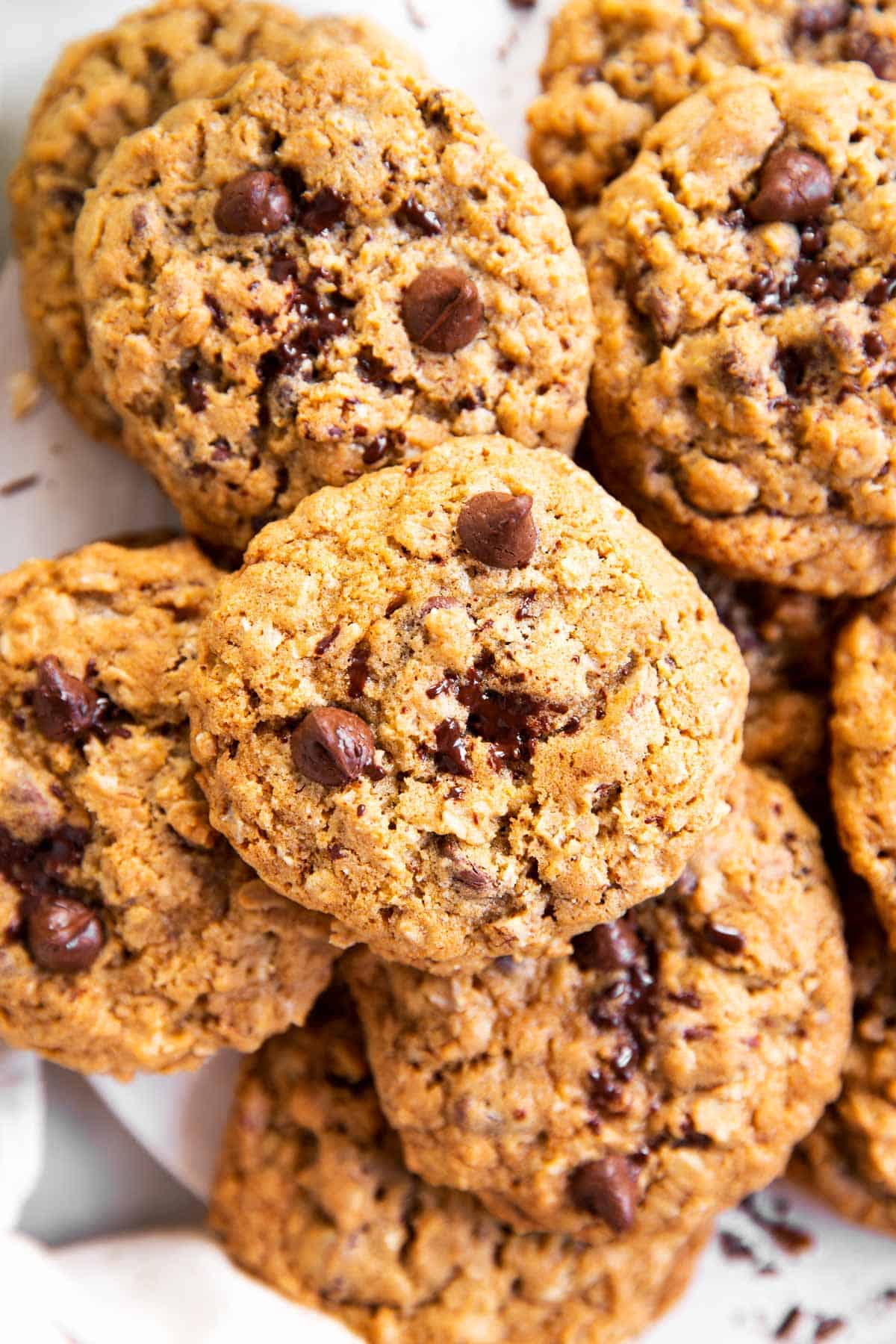 close up photo of oatmeal chocolate chip cookies in a pile