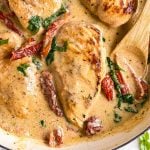 overhead close up view of creamy tuscan chicken in skillet