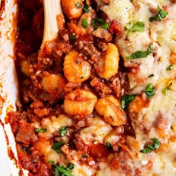 overhead close up view of gnocchi bake in white casserole dish