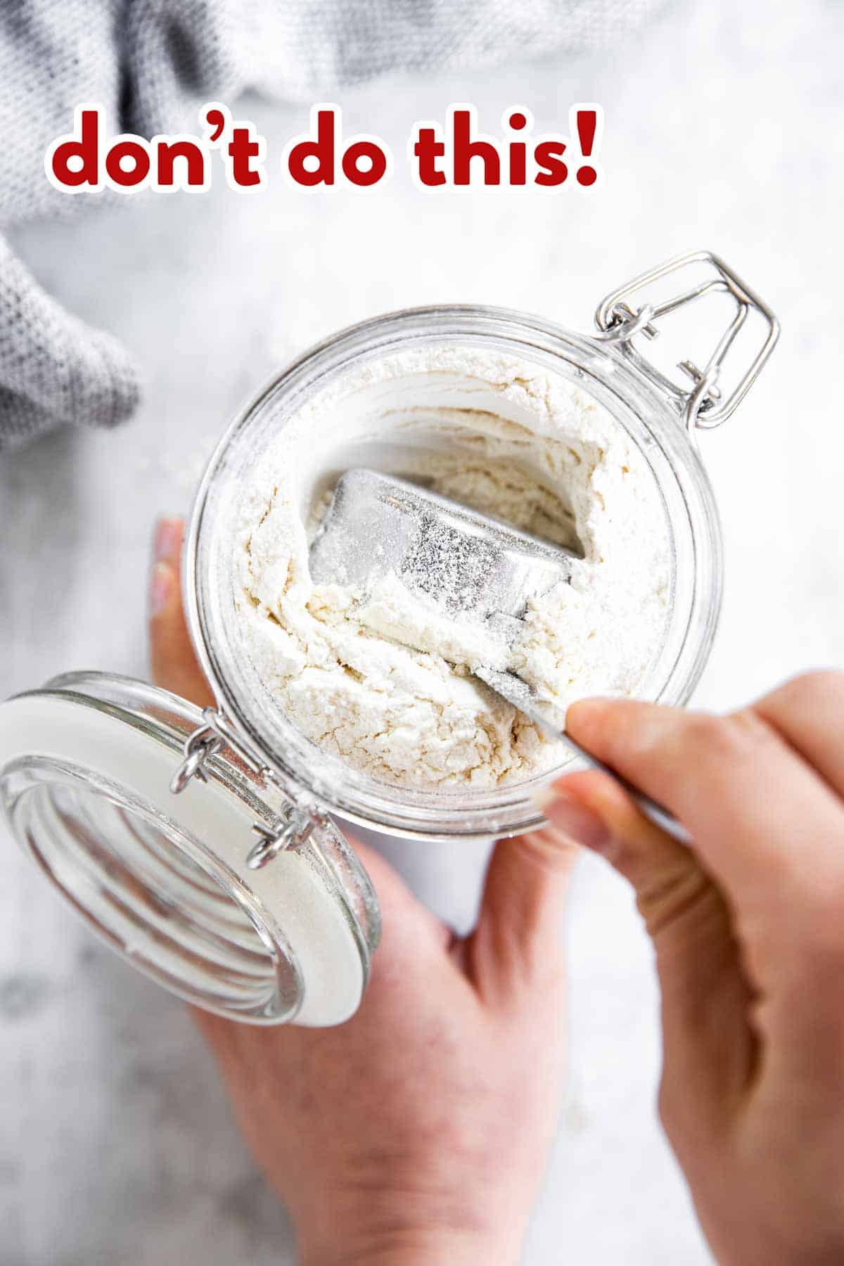 female hand scooping flour with measuring cup, red text overlay saying "don't do this!"