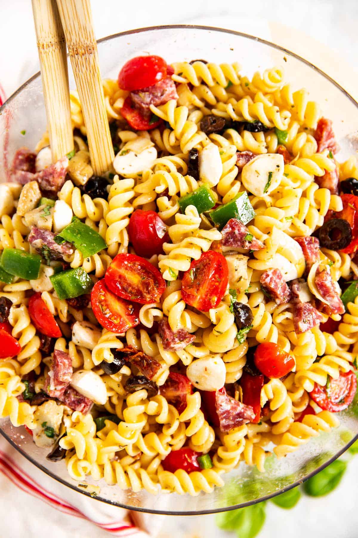 overhead view of Italian pasta salad in glass bowl