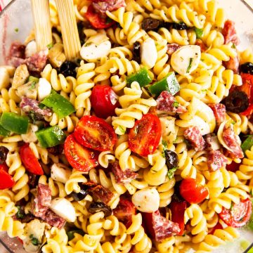 overhead view of Italian pasta salad in glass bowl