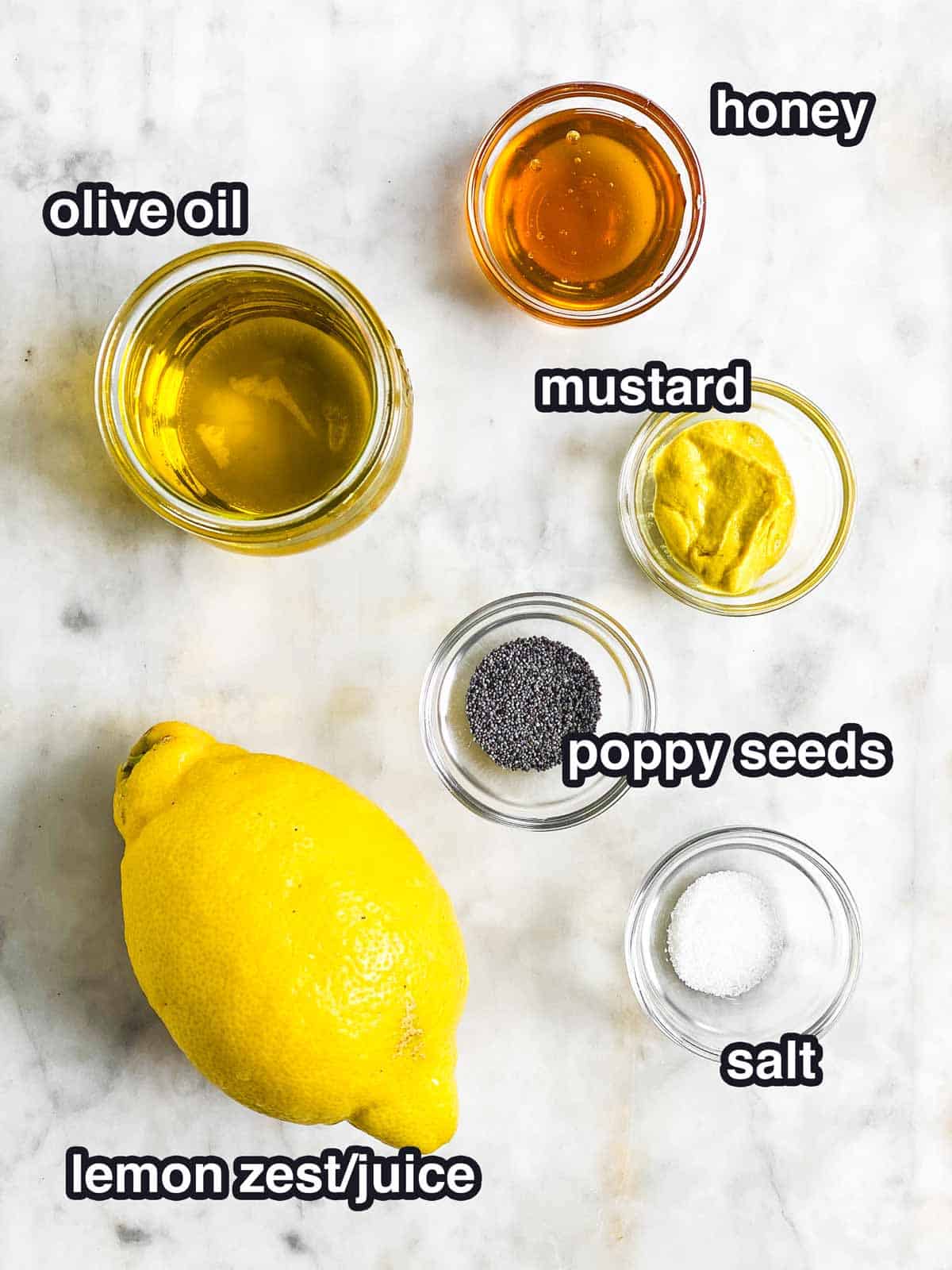 ingredients for lemon poppy seed salad dressing with text labels