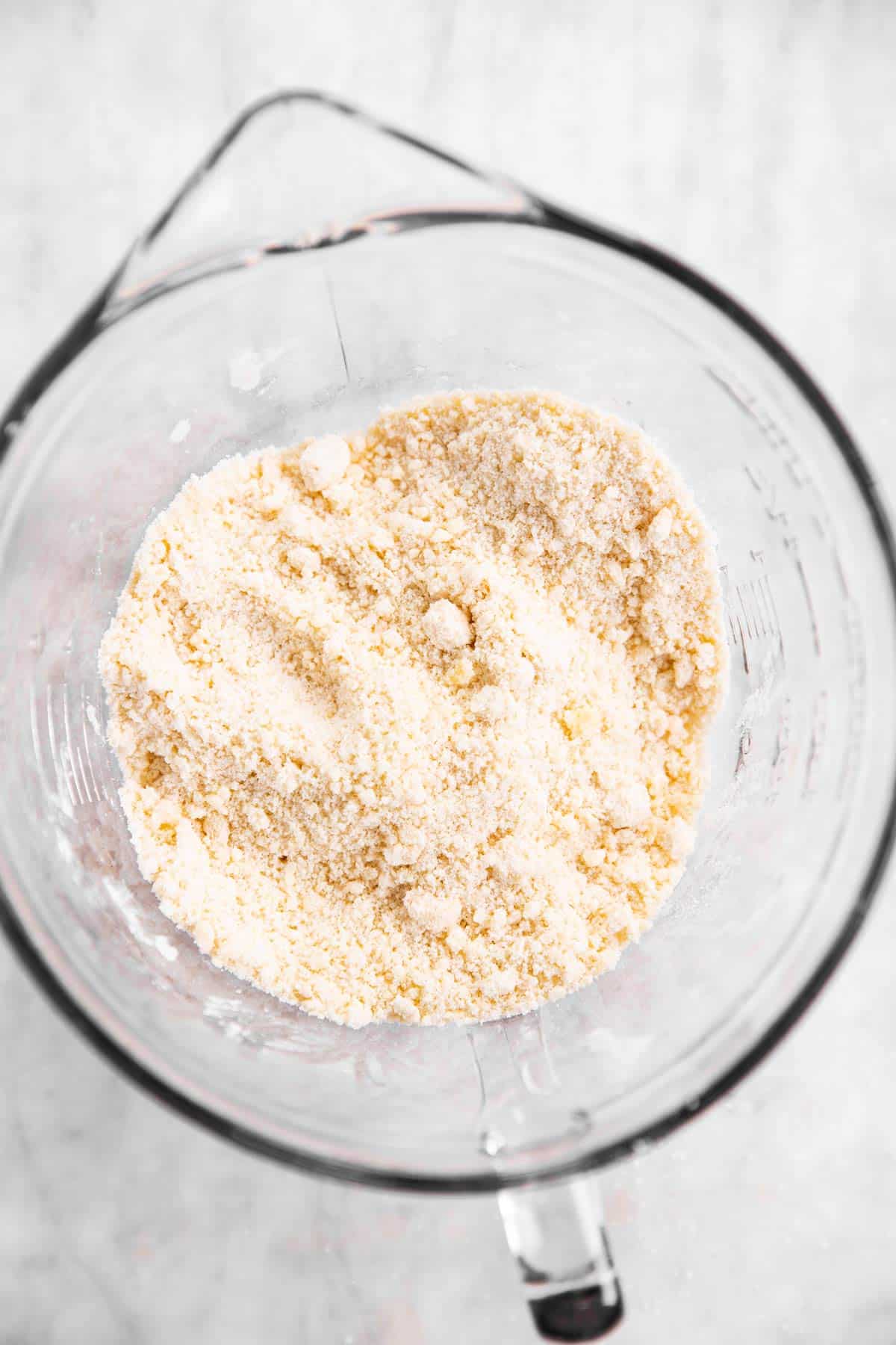 butter cut into flour in glass bowl