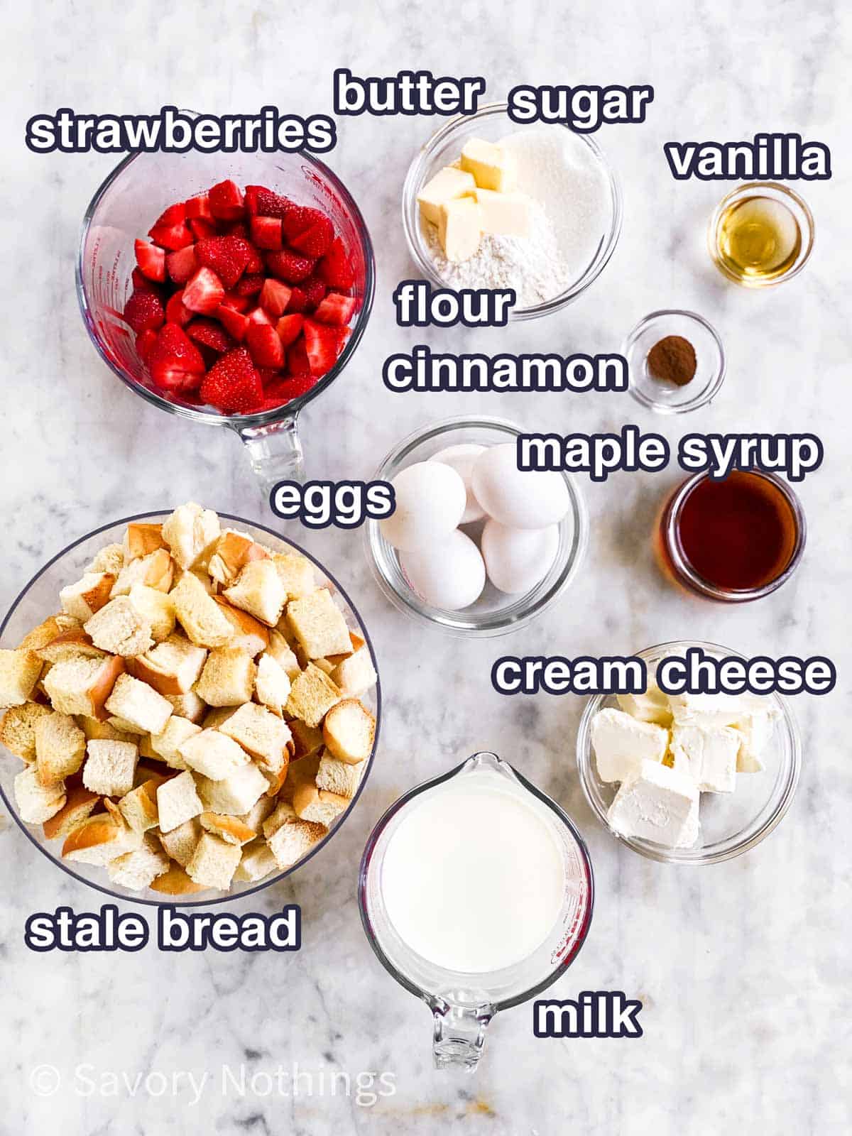 ingredients for strawberry French toast casserole with text labels