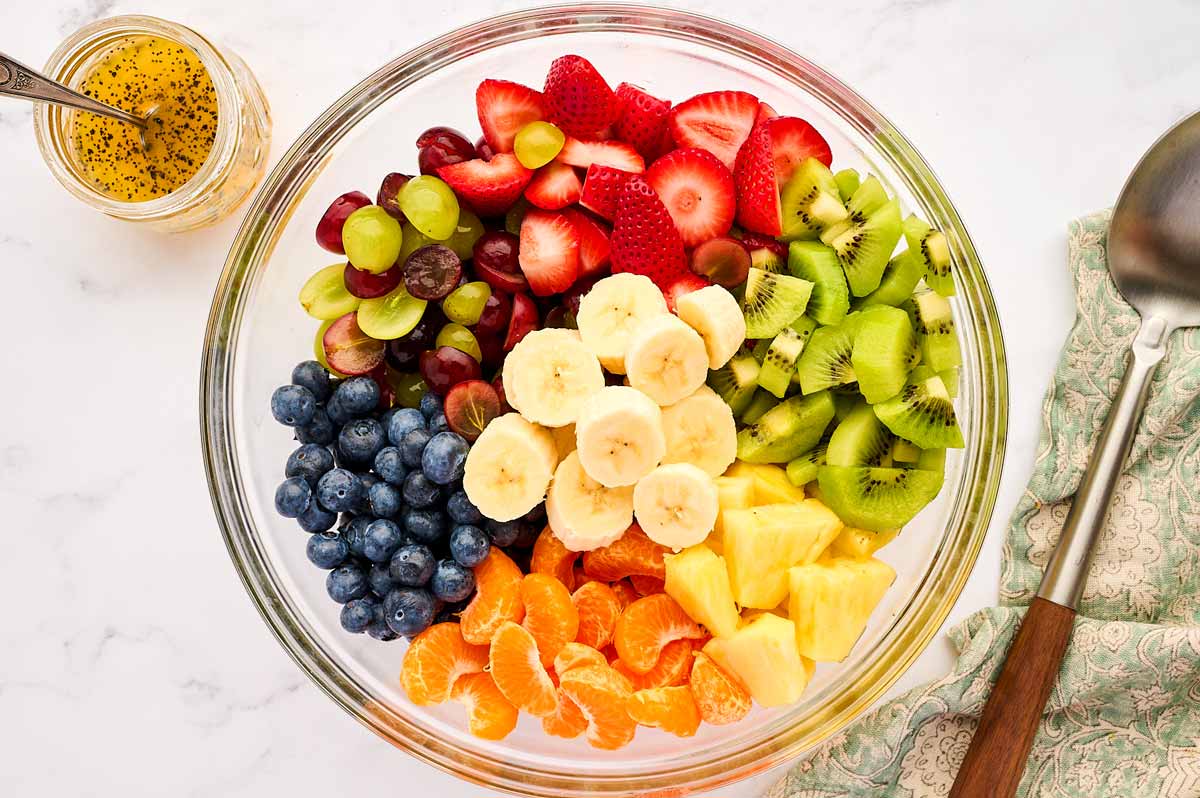 Sliced fruit in a glass bowl.