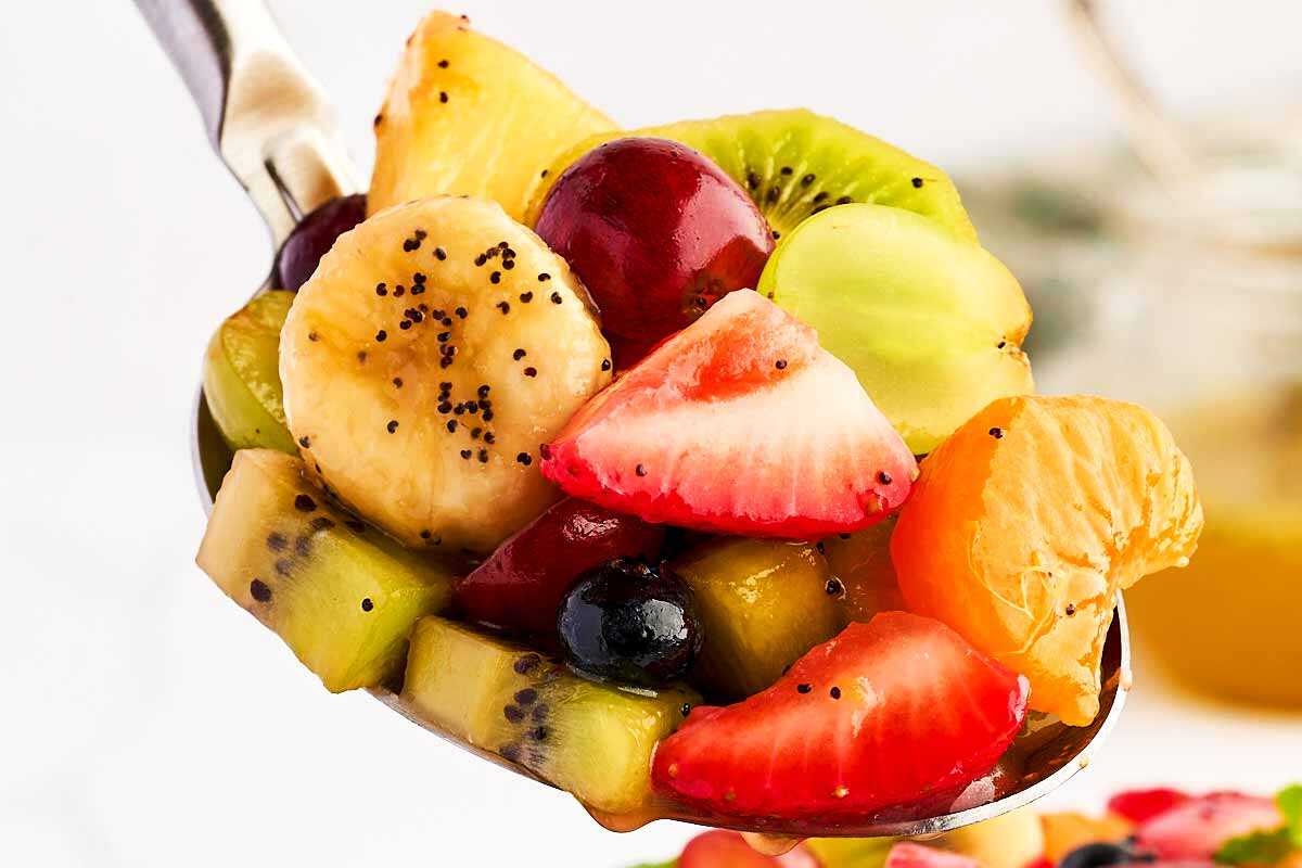 Fresh fruit salad on a spoon.