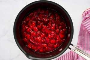 Cooked strawberry filling in pot.
