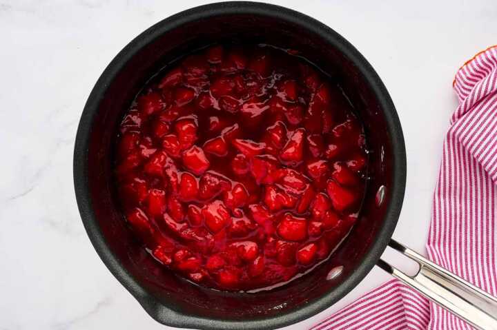 Cooked strawberry filling in pot.