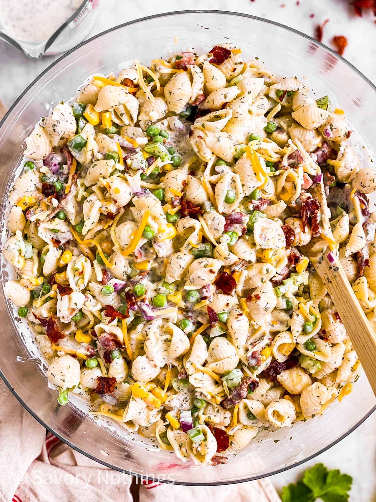 overhead view of glass bowl filled with bacon ranch pasta salad
