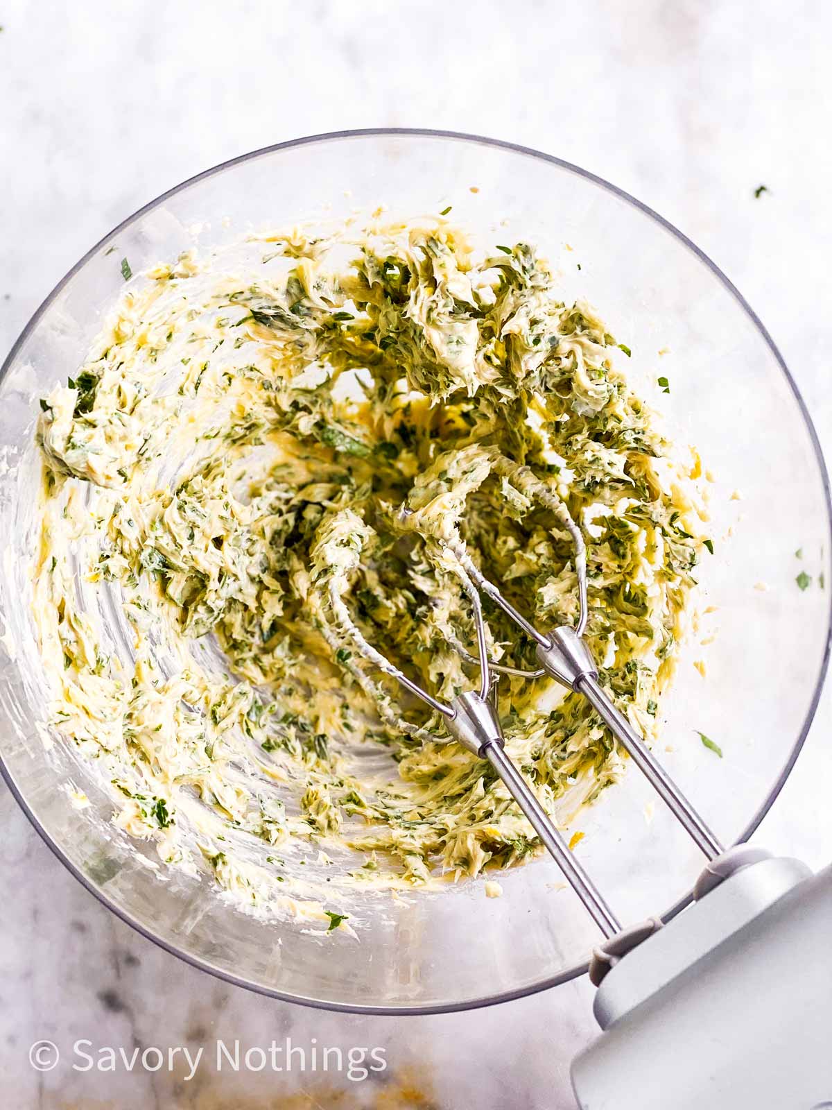 whipped garlic herb butter in glass bowl