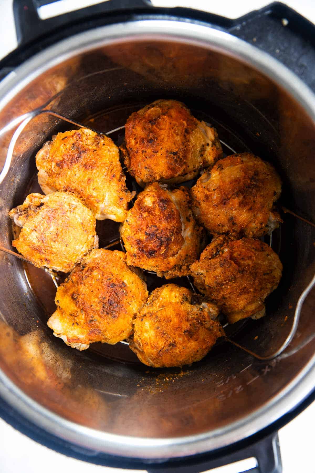 cooked chicken thighs in instant pot on top of trivet