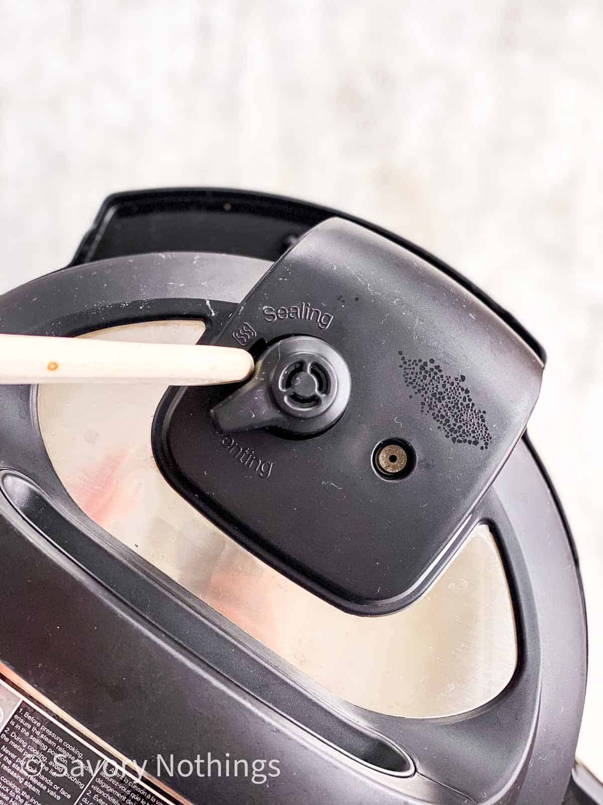 wooden stick moving valve on instant pot lid