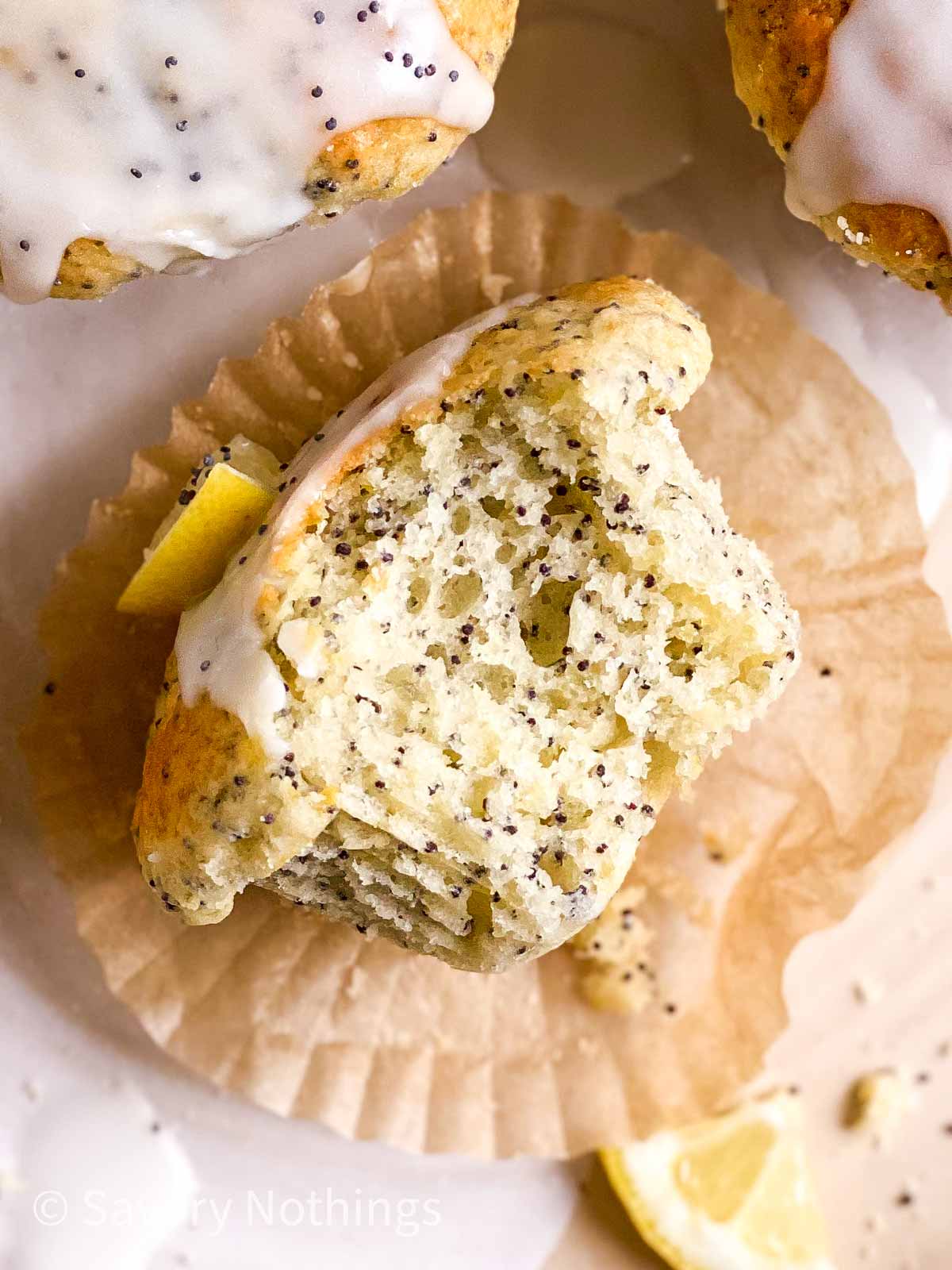 overhead view of lemon poppy seed muffin with bite taken out