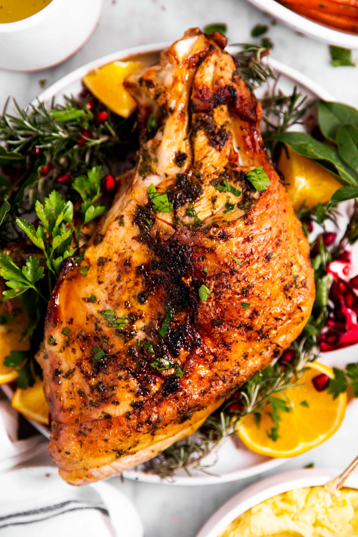 overhead view of air fryer turkey breast on garnished plate