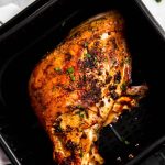 overhead view of turkey breast in air fryer basket