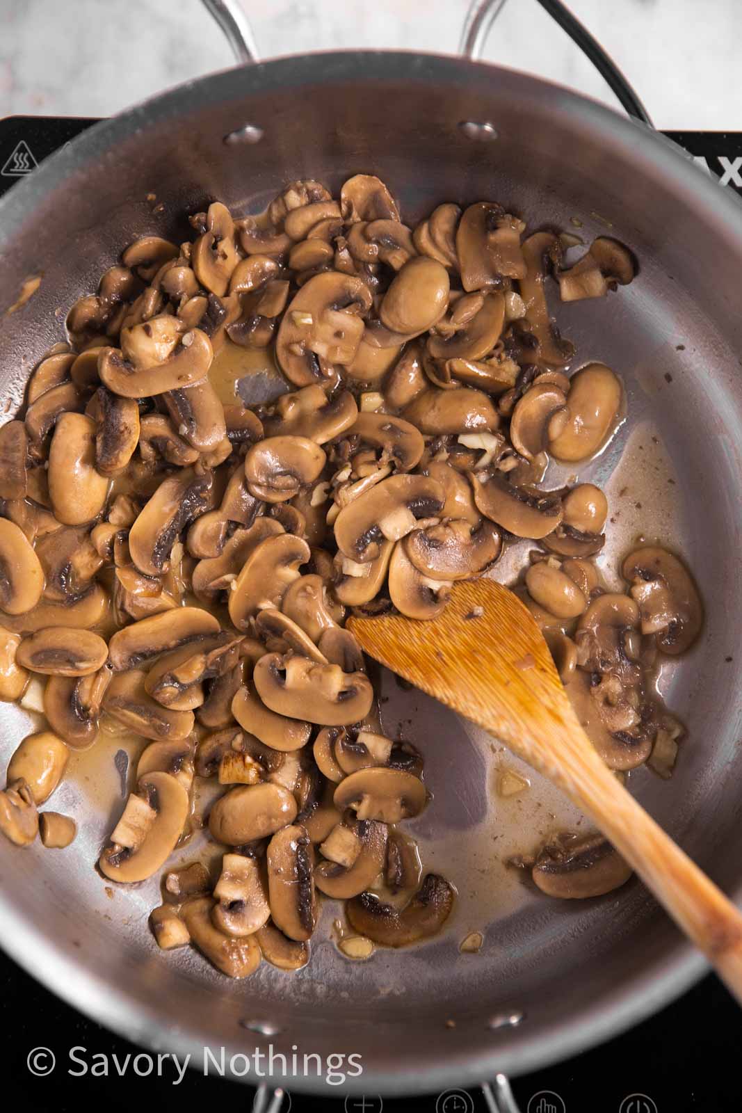 sautéed mushrooms and garlic in skillet