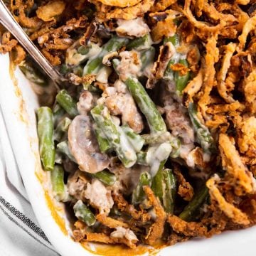 overhead view of green bean casserole with spoon stuck inside