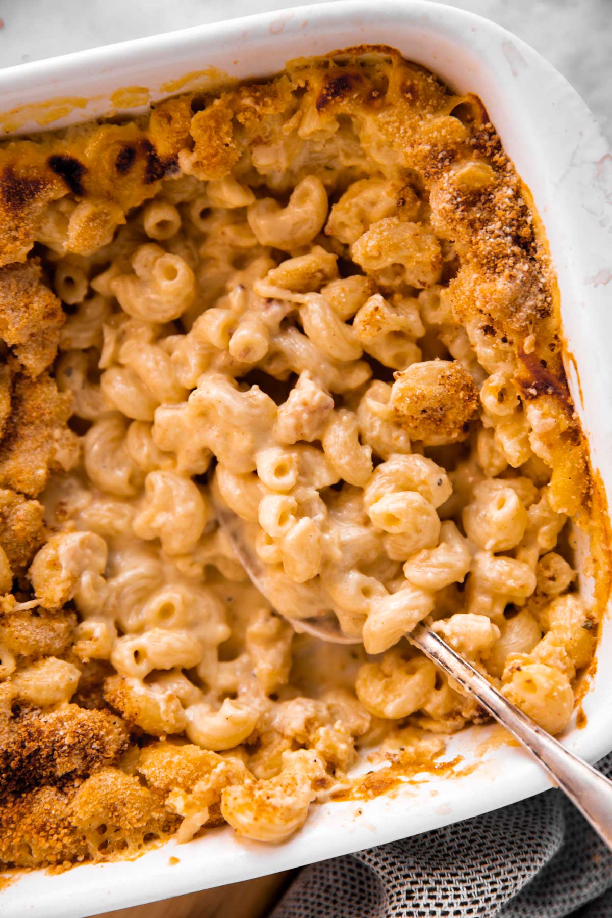 overhead view of baked mac and cheese in white casserole dish